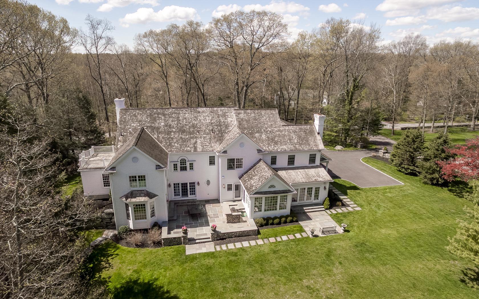 1601 Ponus Ridge Road New Canaan, CT 06840 - Photo 4 of 88 an aerial view of a house with swimming pool and a yard