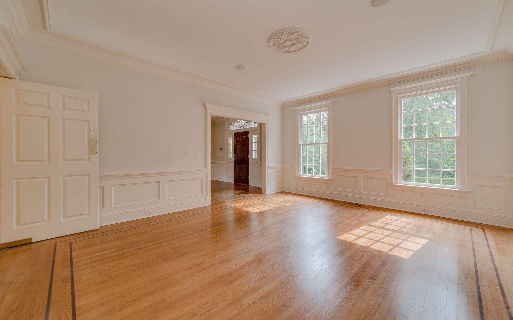 1601 Ponus Ridge Road New Canaan, CT 06840 - Photo 44 of 88 an empty room with wooden floor and windows