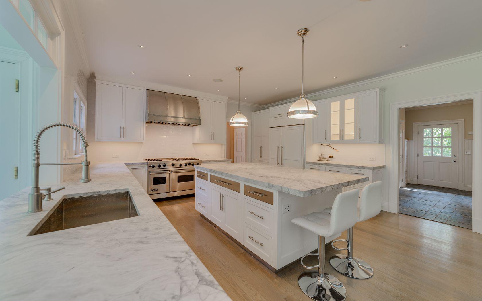 1601 Ponus Ridge Road New Canaan, CT 06840 - Photo 52 of 88 a kitchen with stainless steel appliances granite countertop a stove and a sink