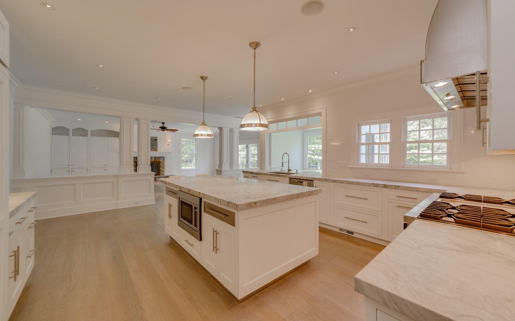 1601 Ponus Ridge Road New Canaan, CT 06840 - Photo 62 of 88 a kitchen with stainless steel appliances granite countertop a stove and a sink