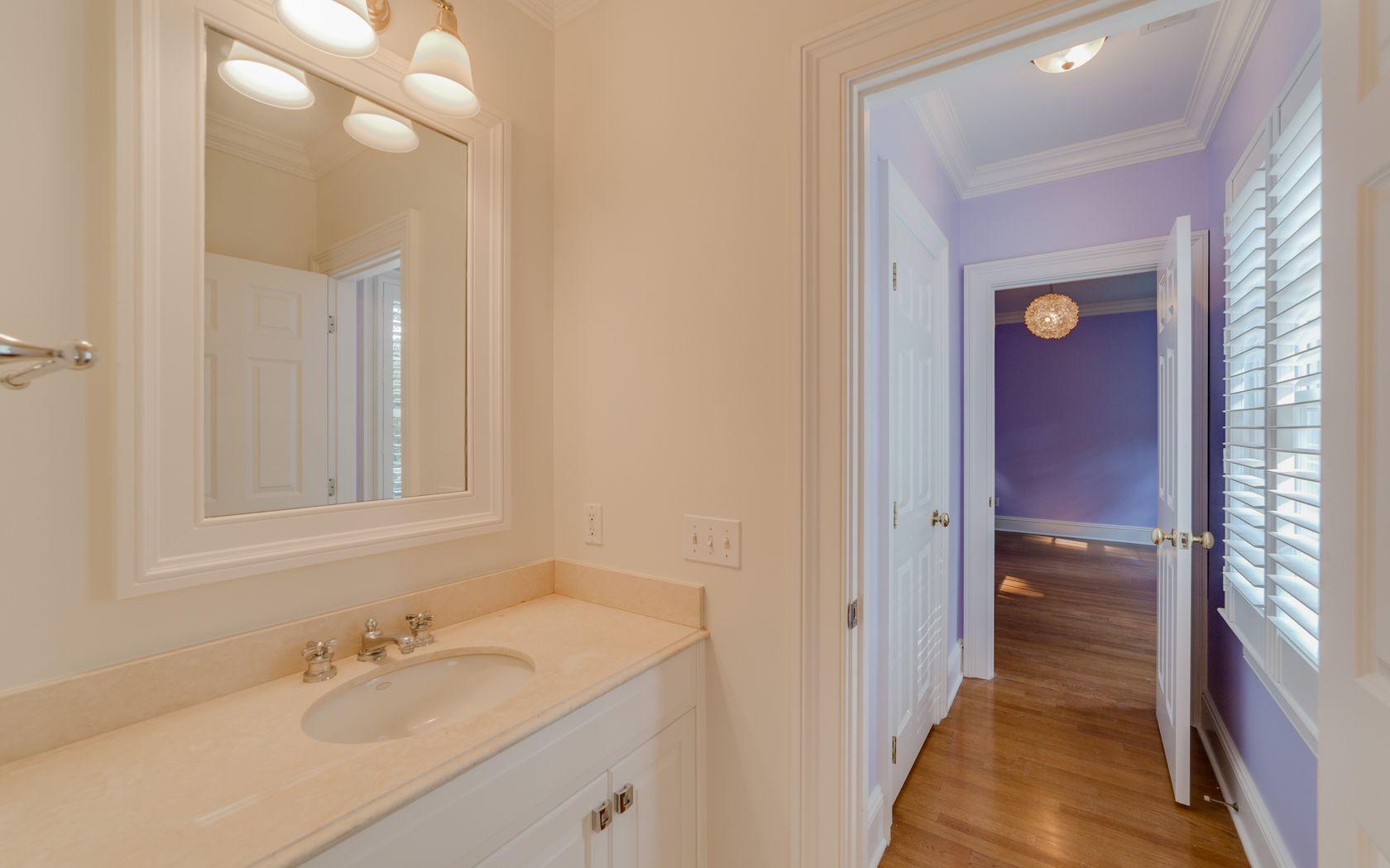 1601 Ponus Ridge Road New Canaan, CT 06840 - Photo 68 of 88 a bathroom with a sink a light fixture and a mirror