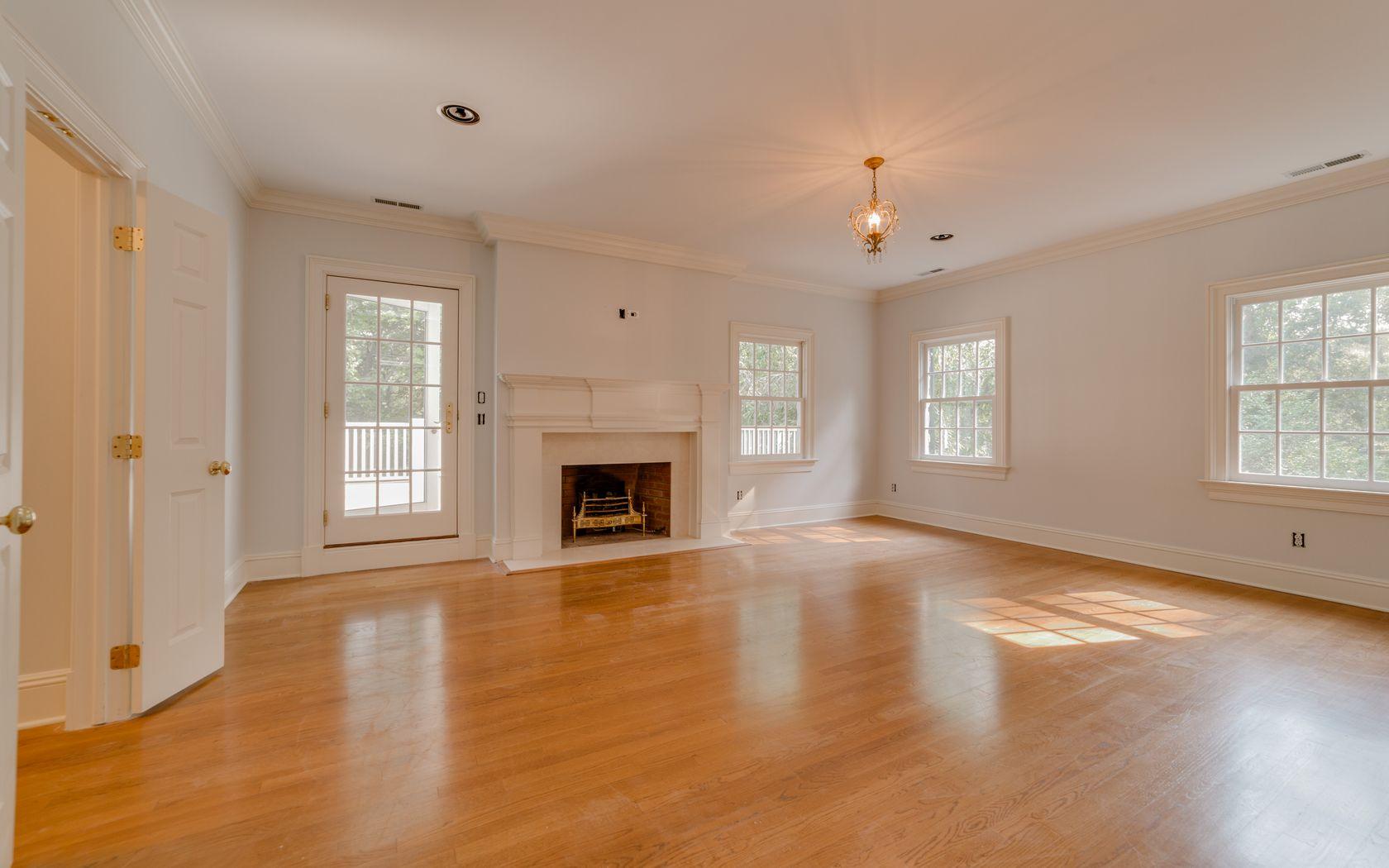 1601 Ponus Ridge Road New Canaan, CT 06840 - Photo 70 of 88 an empty room with windows and fireplace