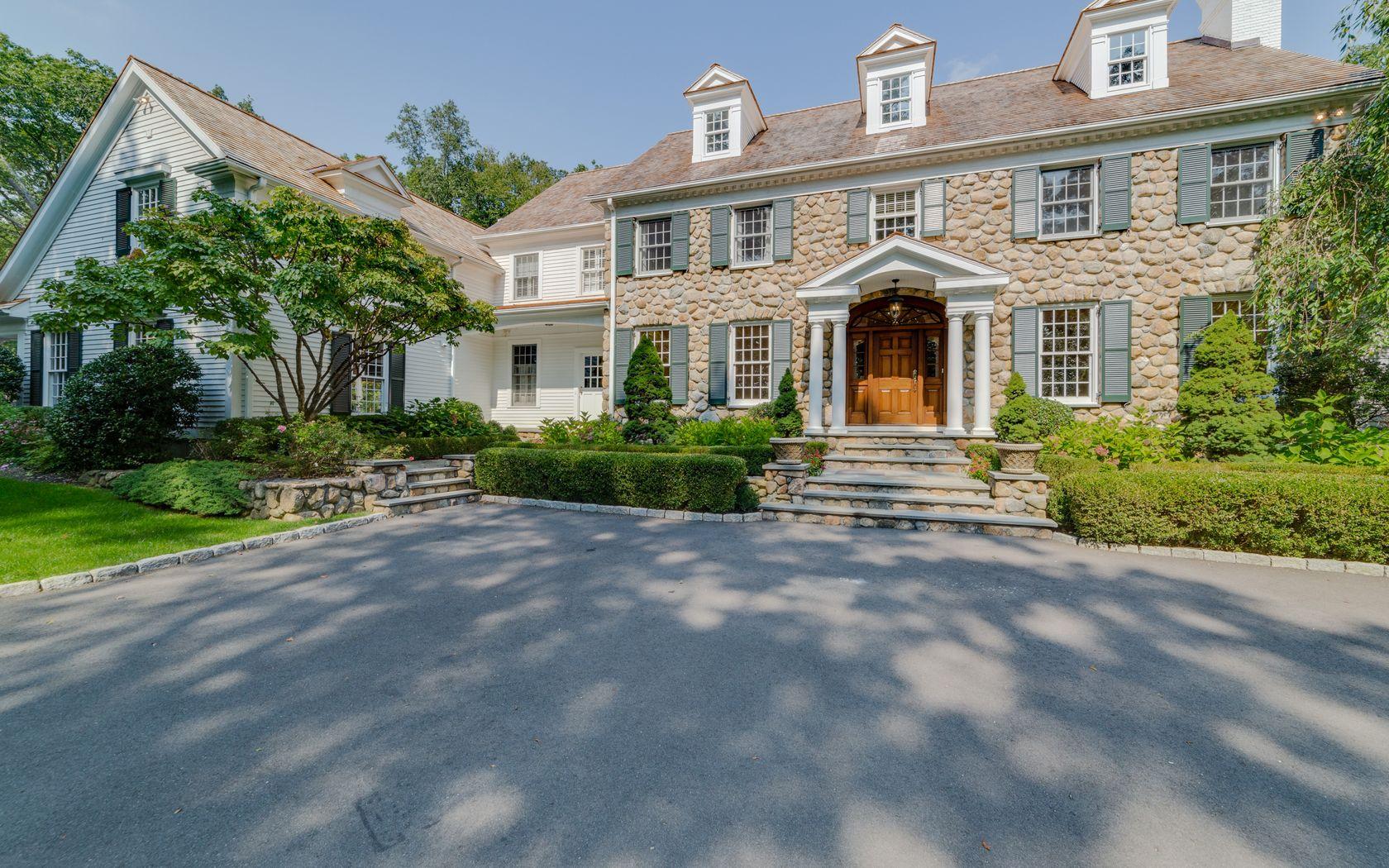 1601 Ponus Ridge Road New Canaan, CT 06840 - Photo 80 of 88 a front view of a house with a yard