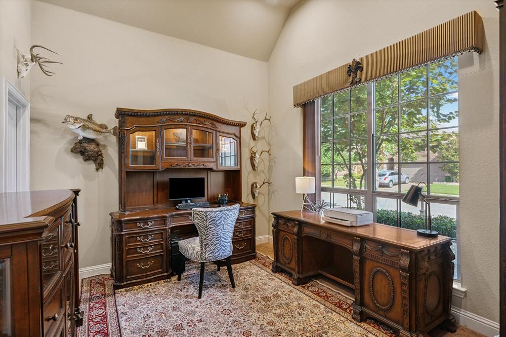 1007 Somerset Circle Forney, TX 75126 - Photo 20 of 34 a view of a workspace with furniture and a window