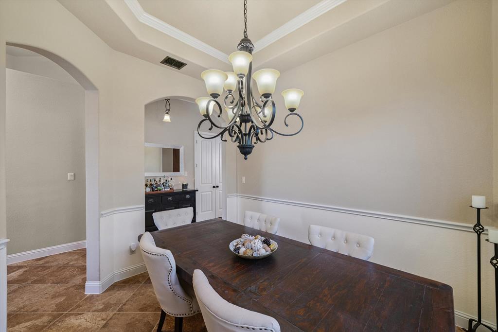 1007 Somerset Circle Forney, TX 75126 - Photo 22 of 34 a view of a dining room with furniture and chandelier