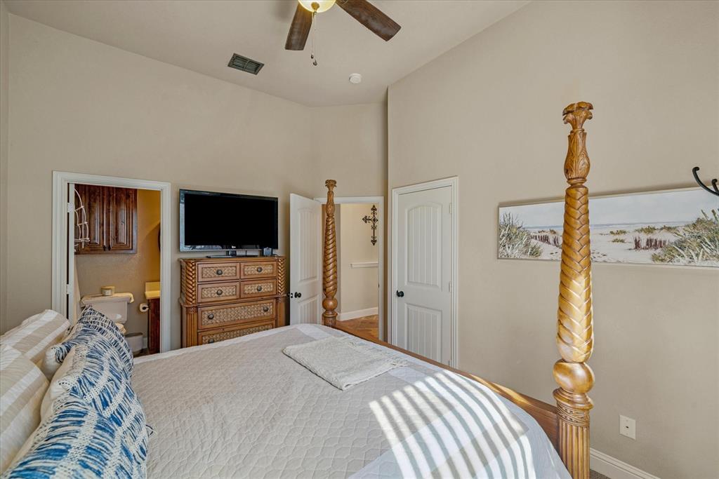 1007 Somerset Circle Forney, TX 75126 - Photo 26 of 34 a bedroom with a bed and a flat screen tv