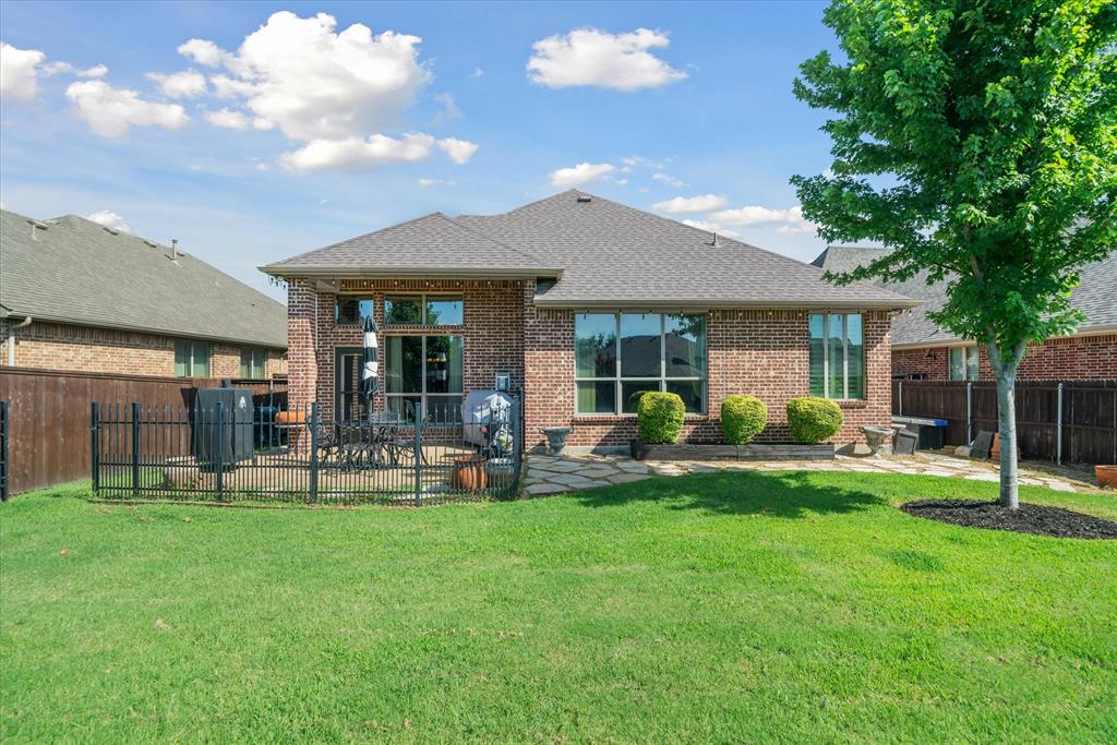 1007 Somerset Circle Forney, TX 75126 - Photo 7 of 34 a view of a house with a yard and sitting area