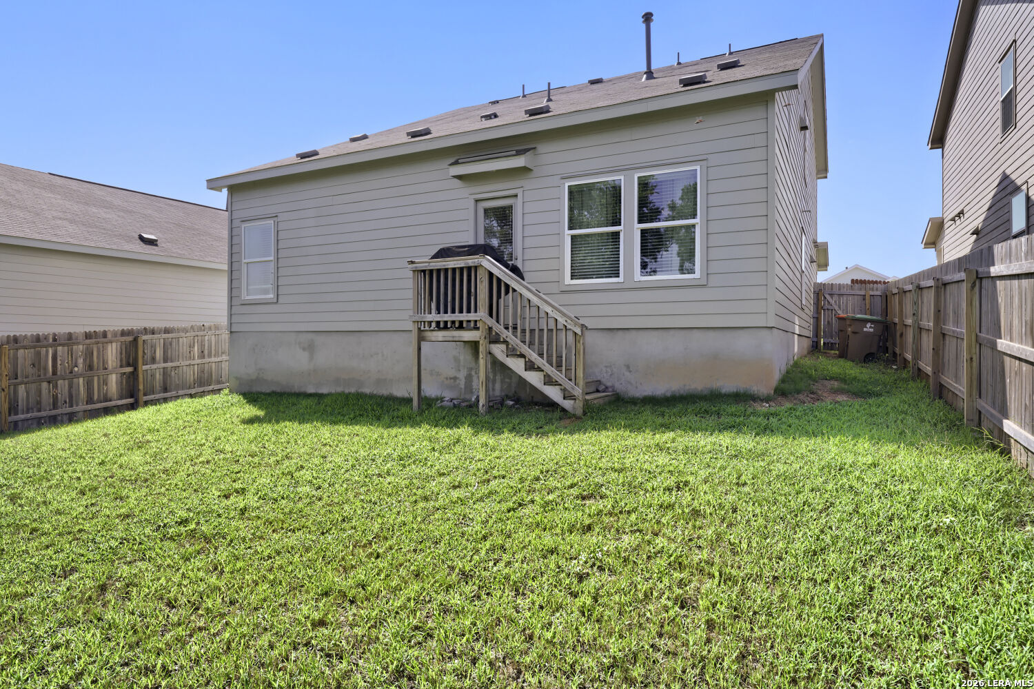 6017 Companion Loop Bulverde, TX 78163 - Photo 27 of 38 a view of a backyard with wooden fence