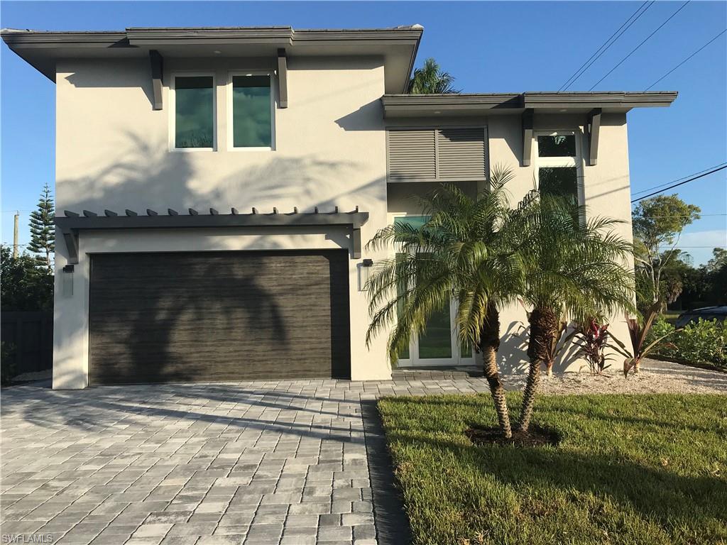 799 104th Avenue North Naples, FL 34108 - Photo 13 of 22 a front view of a house with a yard