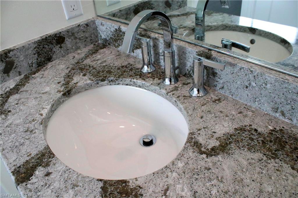 799 104th Avenue North Naples, FL 34108 - Photo 17 of 22 a bathroom with a sink and mirror