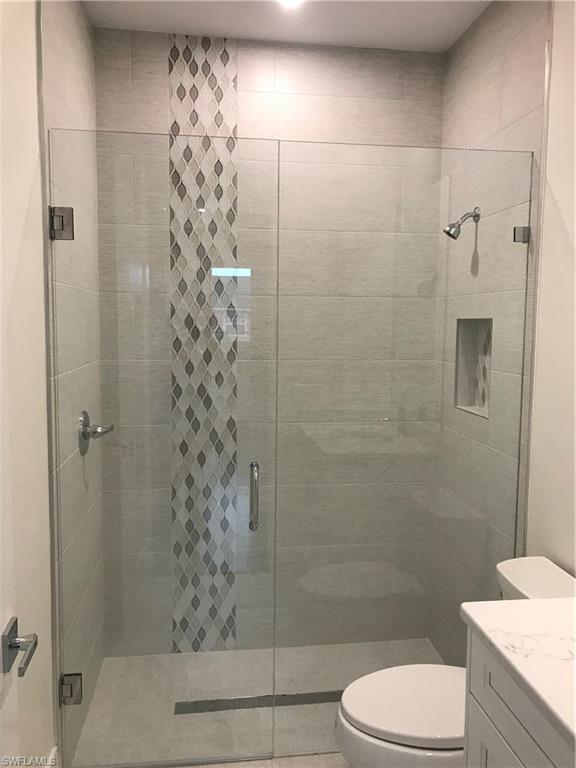 799 104th Avenue North Naples, FL 34108 - Photo 19 of 22 a bathroom with a shower and toilet