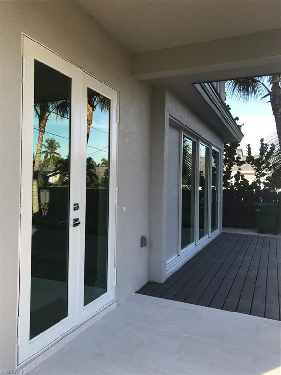 799 104th Avenue North Naples, FL 34108 - Photo 20 of 22 front view of house with porch