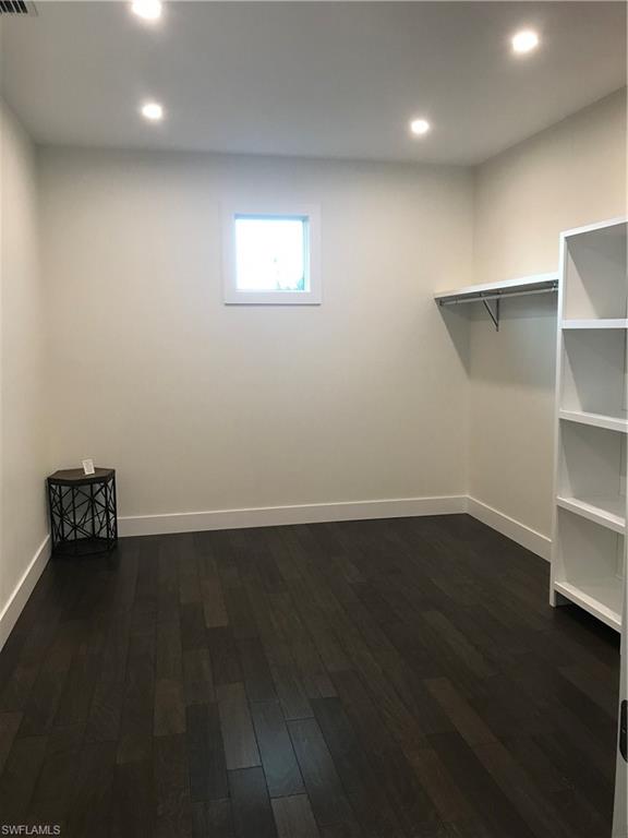 799 104th Avenue North Naples, FL 34108 - Photo 21 of 22 a view of an empty room with wooden floor and a window