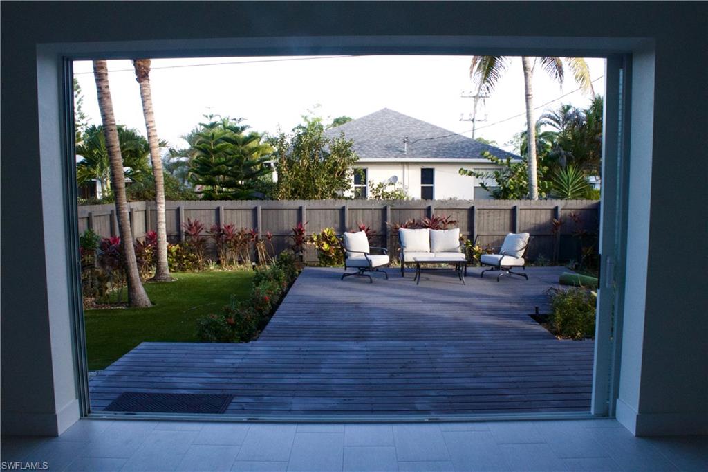 799 104th Avenue North Naples, FL 34108 - Photo 7 of 22 a view of a table and chairs in backyard