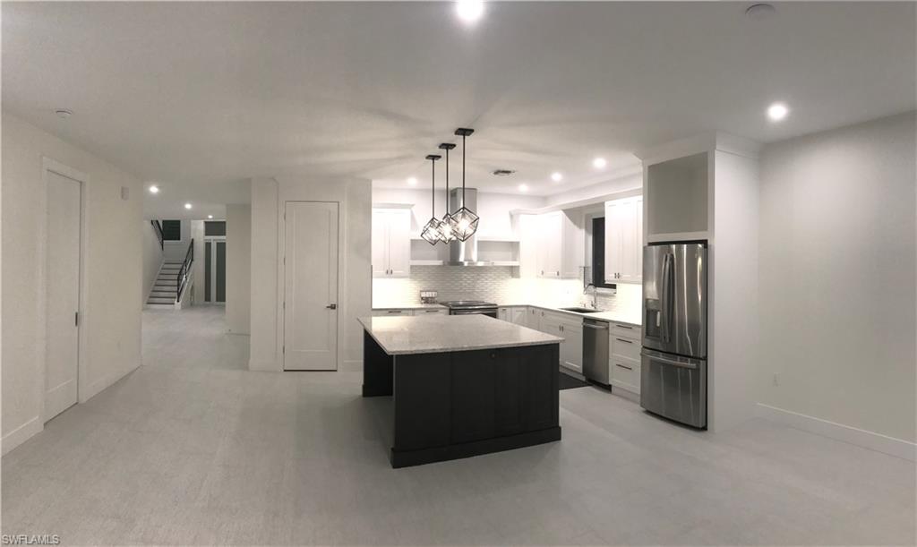 799 104th Avenue North Naples, FL 34108 - Photo 9 of 22 a kitchen with refrigerator and window