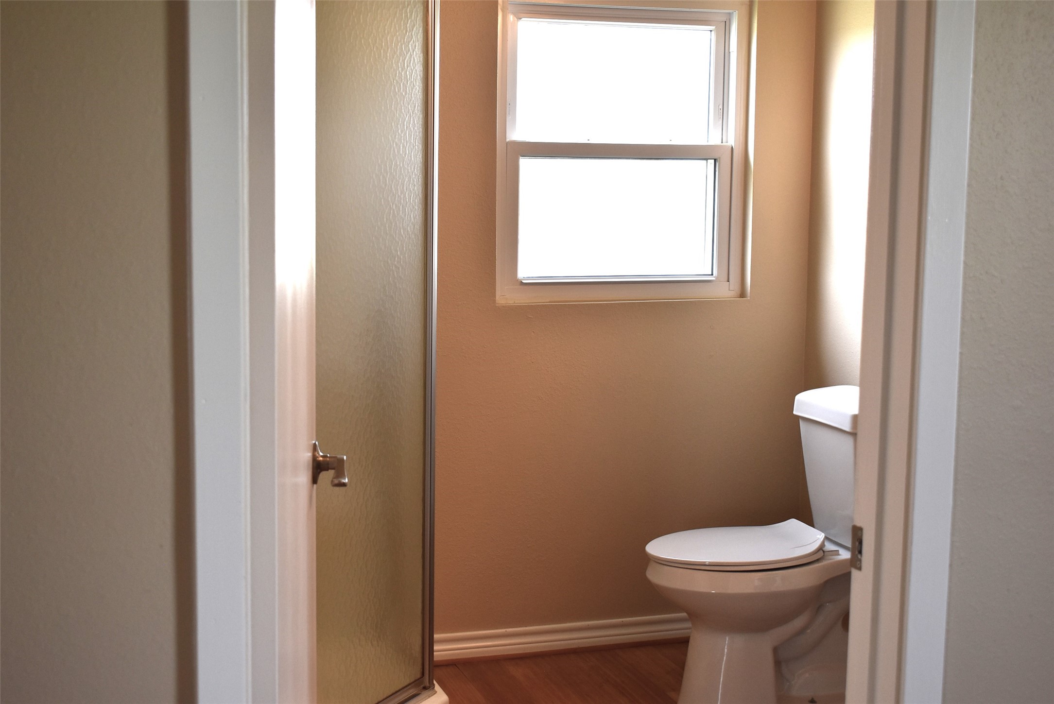 11 Chimaera Street Sargent, TX 77414 - Photo 19 of 40 a white toilet sitting next to a bathroom sink