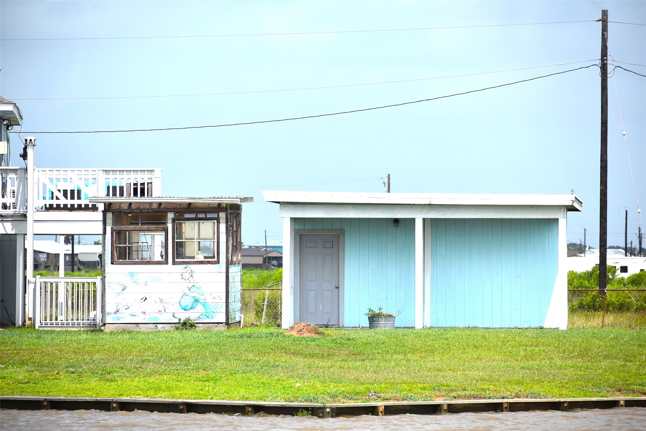 11 Chimaera Street Sargent, TX 77414 - Photo 2 of 40 a view of a house with a yard