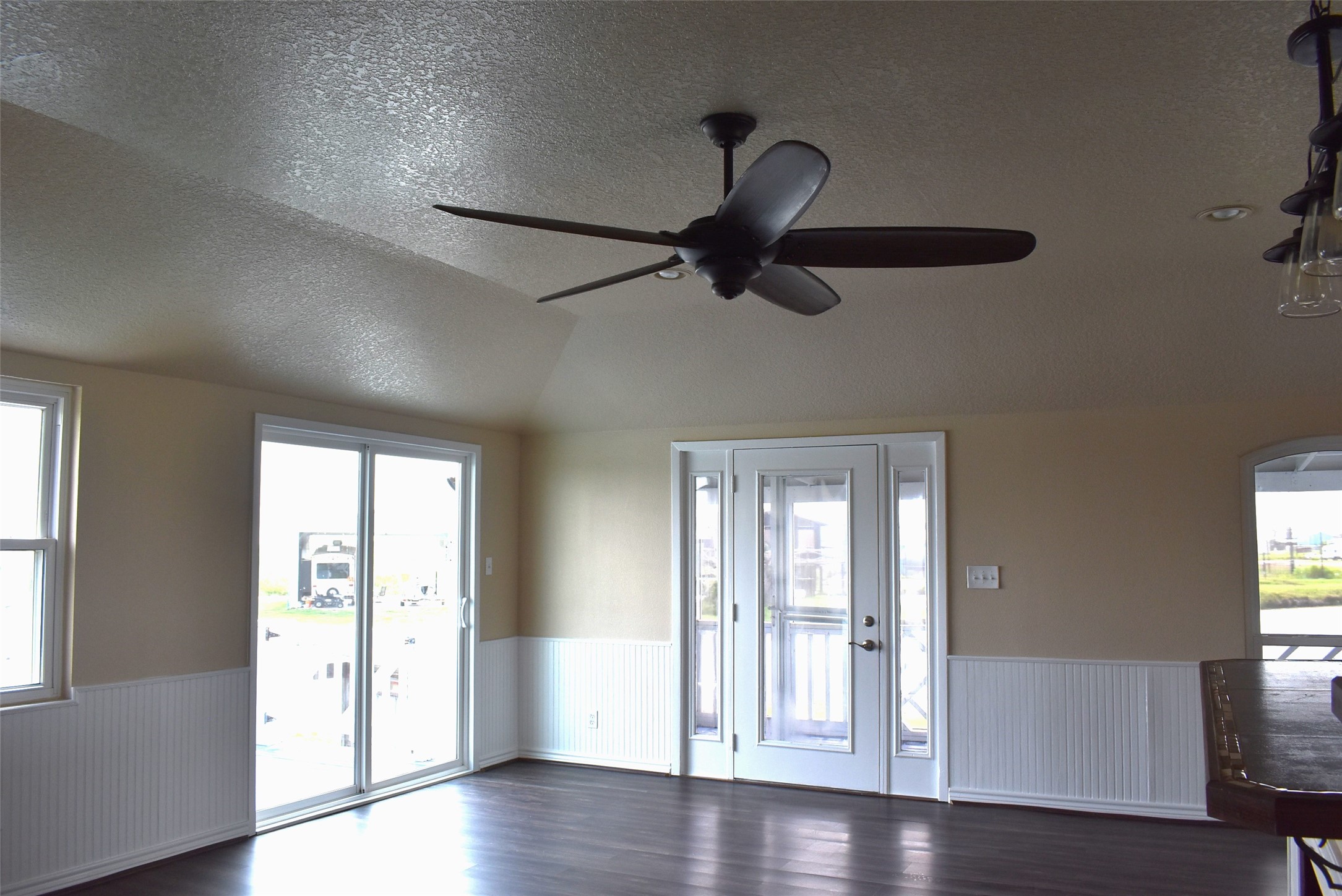 11 Chimaera Street Sargent, TX 77414 - Photo 26 of 40 a view of an empty room with wooden floor and a window