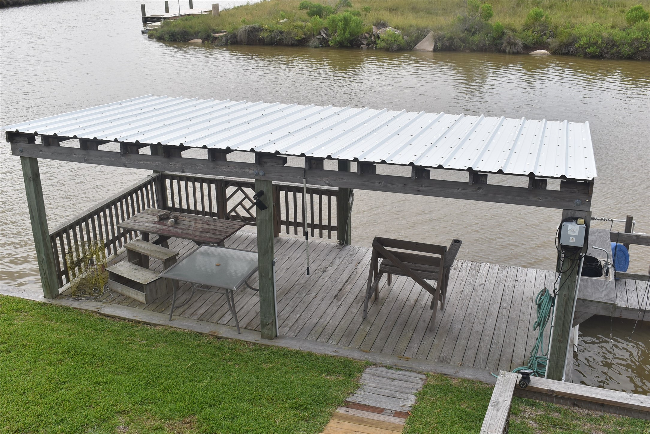 11 Chimaera Street Sargent, TX 77414 - Photo 30 of 40 a view of a terrace with couches and pool