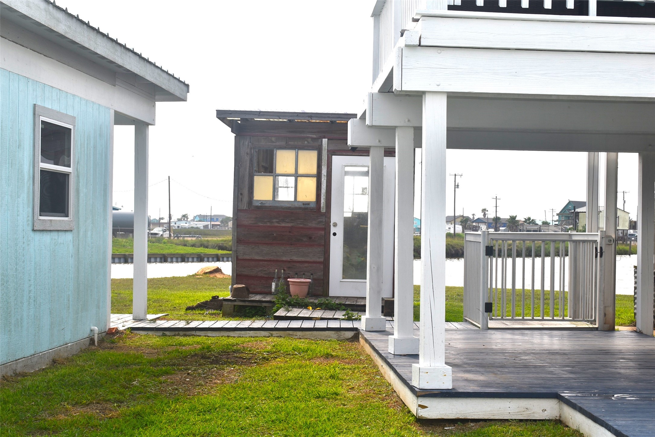 11 Chimaera Street Sargent, TX 77414 - Photo 33 of 40 a view of a swimming pool with a porch