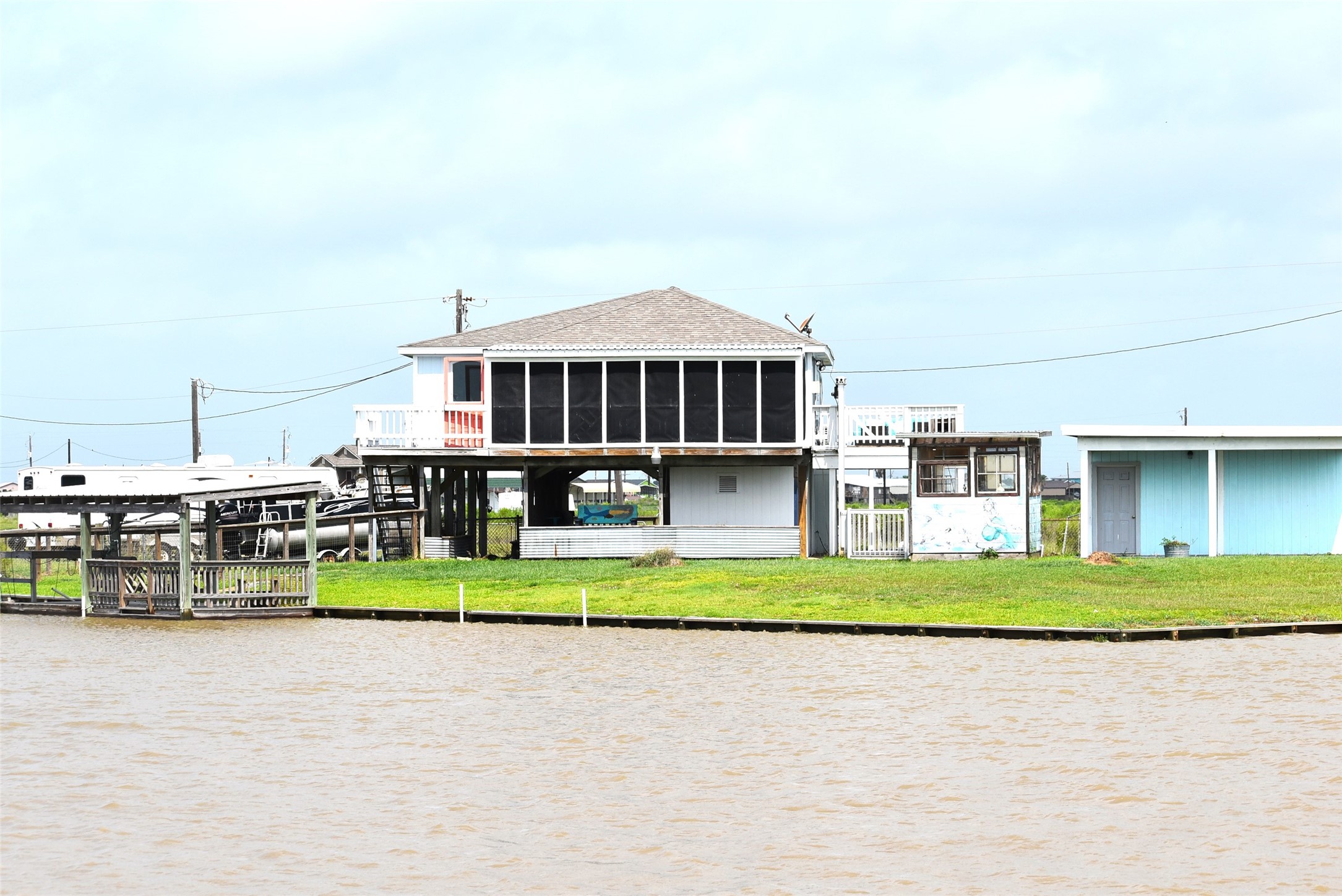 11 Chimaera Street Sargent, TX 77414 - Photo 5 of 40 a front view of a house with a yard