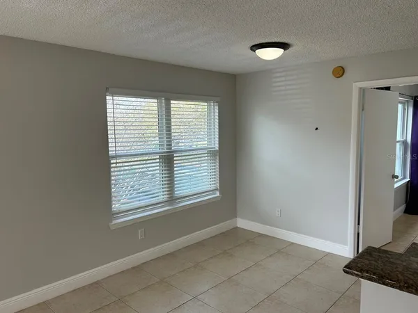 a kitchen with a sink refrigerator and microwave