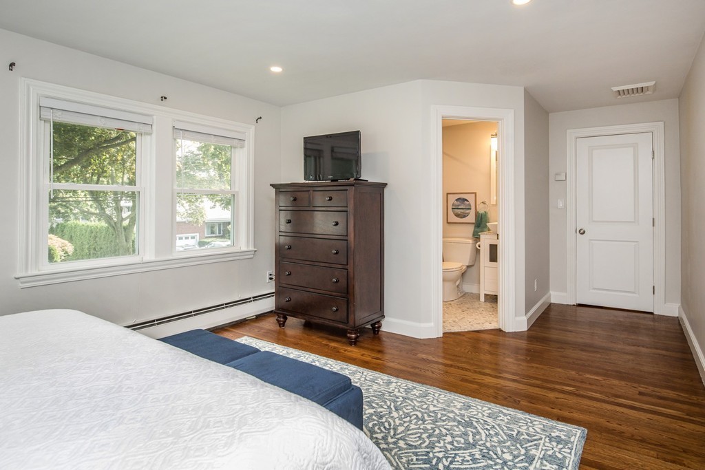 31 Ralph Road Marblehead, MA 01945 - Photo 16 of 24 a bedroom with a bed and wooden floor