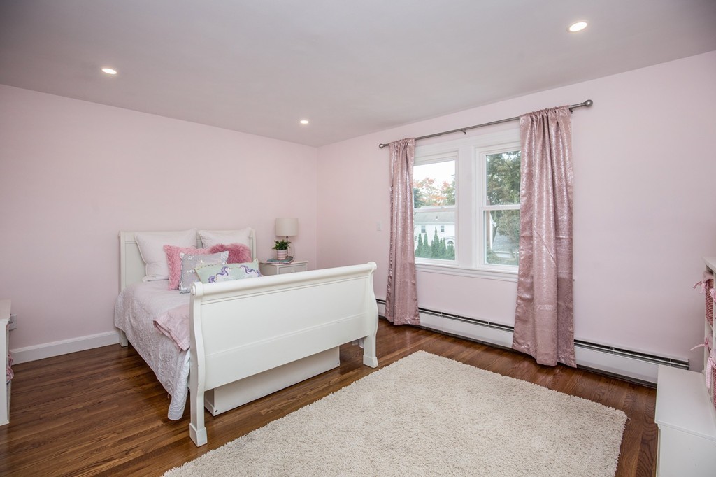 31 Ralph Road Marblehead, MA 01945 - Photo 18 of 24 a white bed sitting in a room next to a window