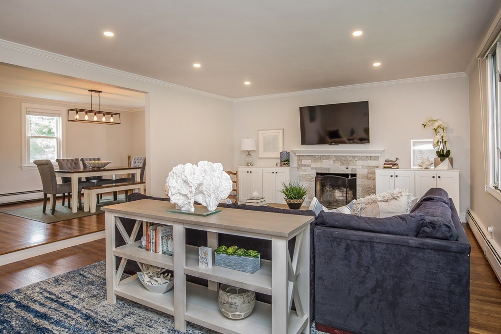 31 Ralph Road Marblehead, MA 01945 - Photo 3 of 24 a living room with furniture a flat screen tv and a fireplace