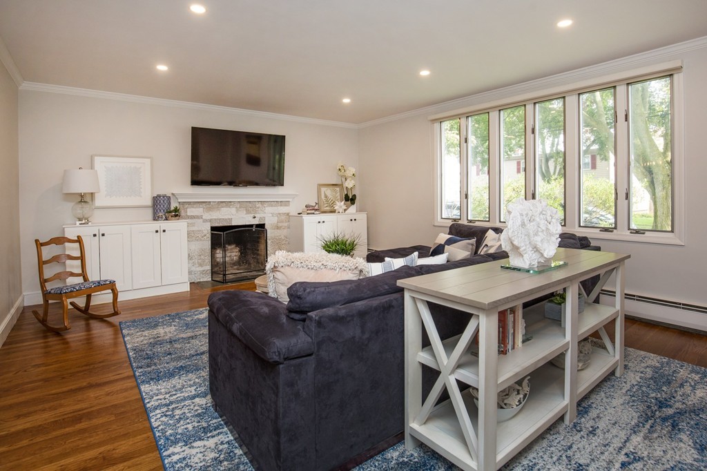 31 Ralph Road Marblehead, MA 01945 - Photo 4 of 24 a living room with furniture fireplace and a flat screen tv