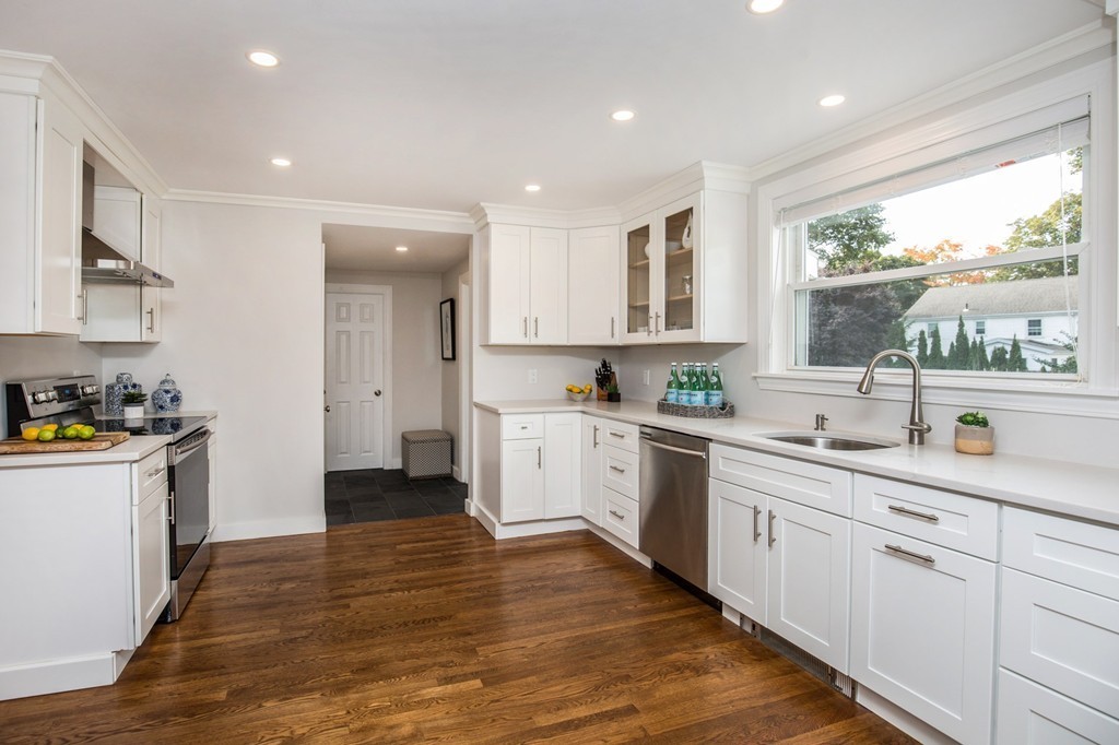 31 Ralph Road Marblehead, MA 01945 - Photo 8 of 24 a kitchen with a sink window and cabinets