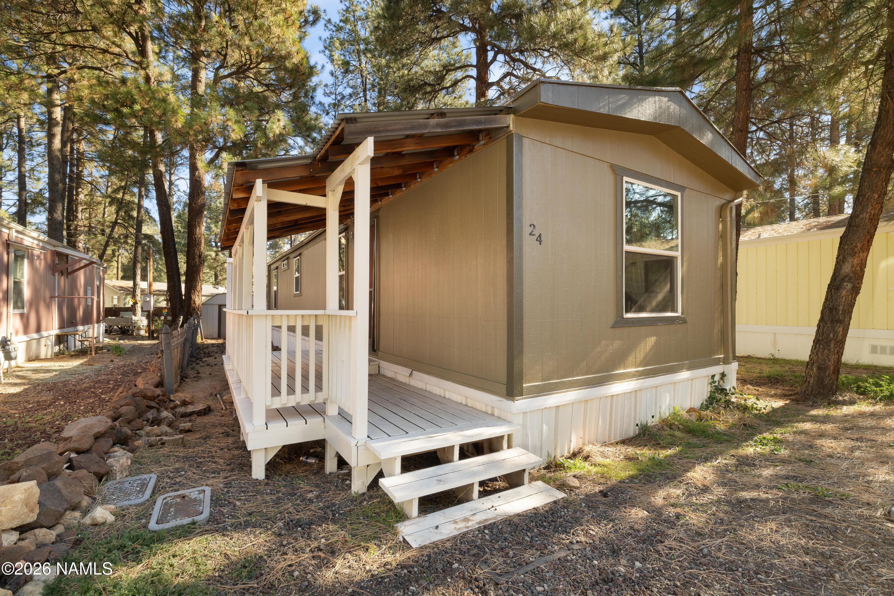 2500 West Rte 66, Unit 24 Flagstaff, AZ 86001 - Photo 11 of 13 a front view of a house with a yard