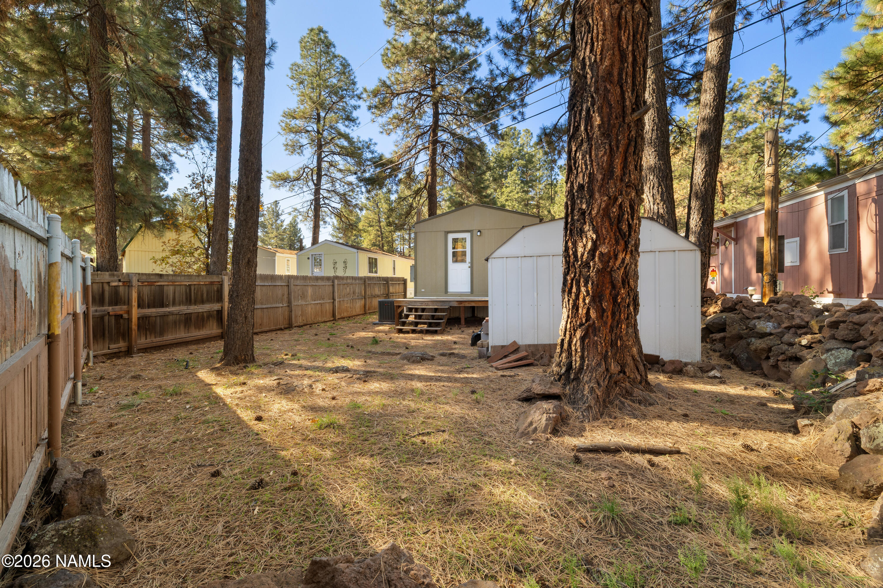 2500 West Rte 66, Unit 24 Flagstaff, AZ 86001 - Photo 13 of 13 a backyard of a house with lots of green space