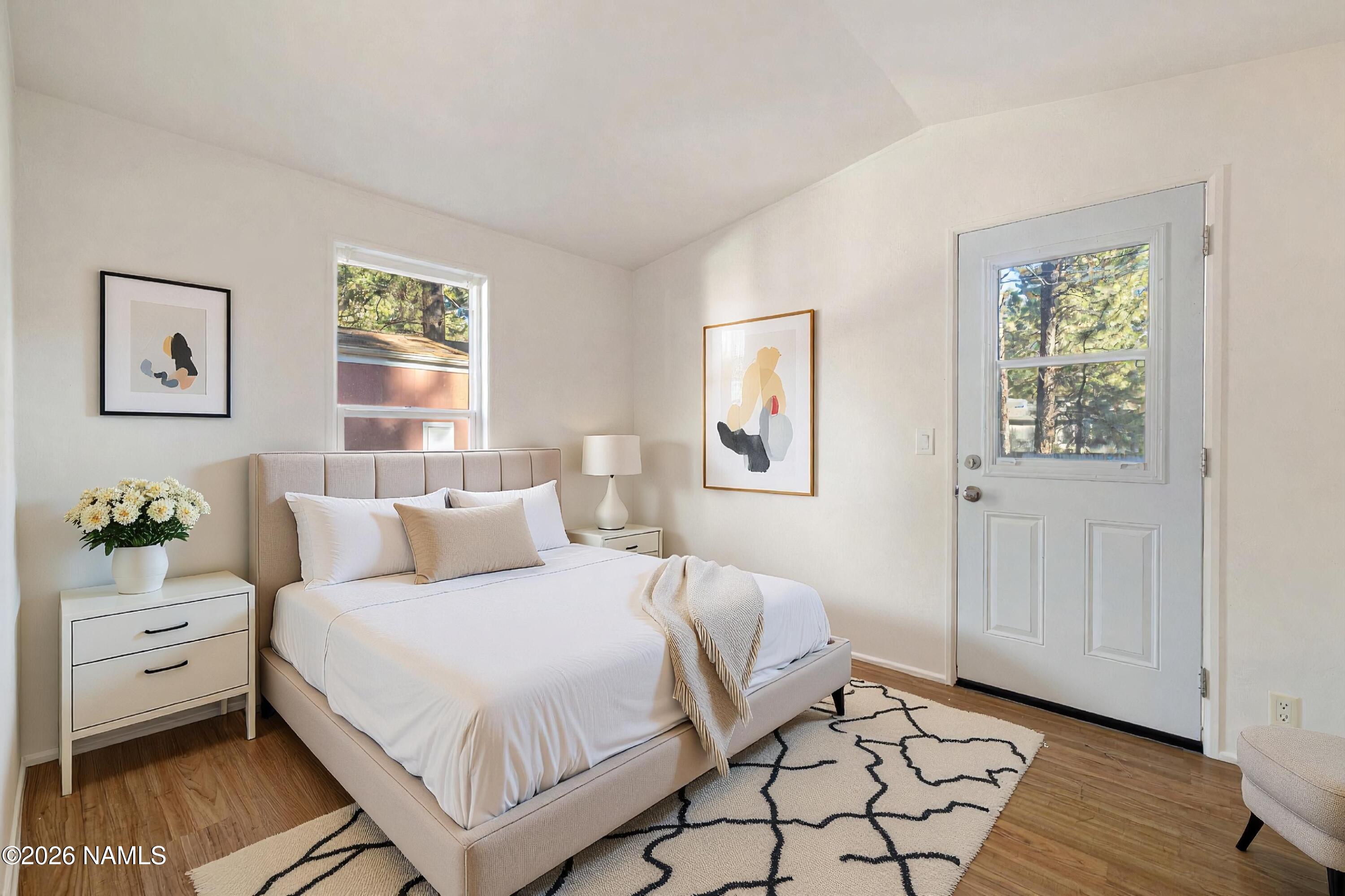 2500 West Rte 66, Unit 24 Flagstaff, AZ 86001 - Photo 7 of 13 a bedroom with a bed and a window