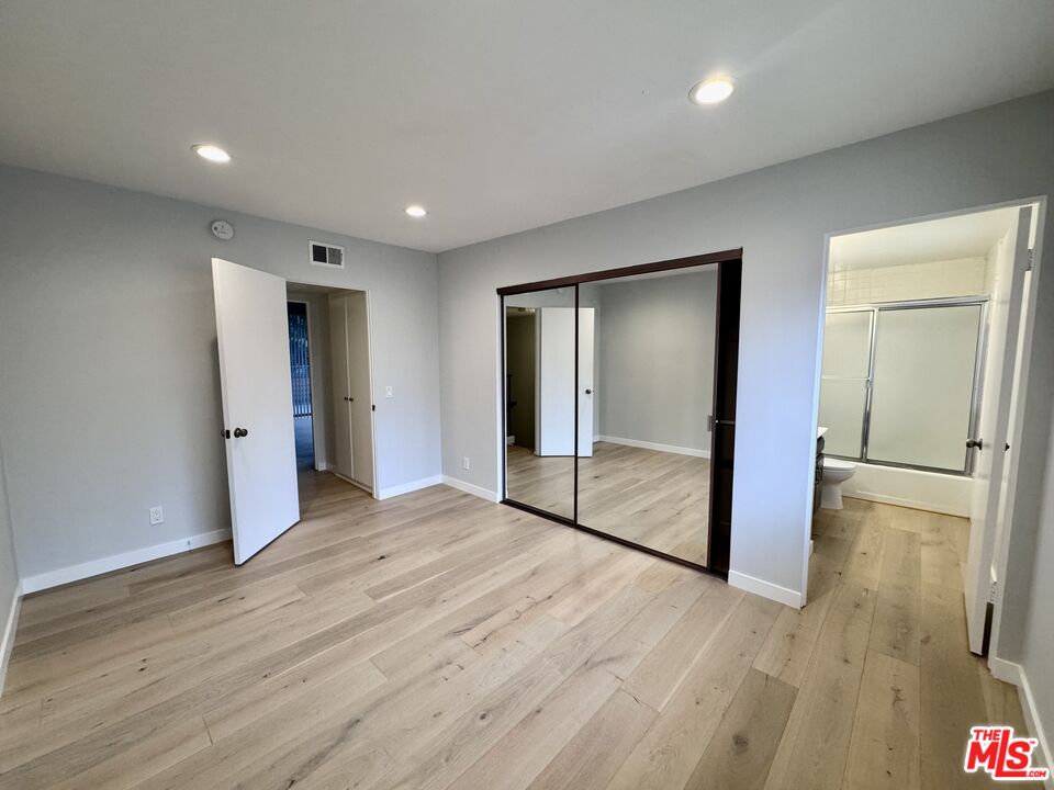 4435 Alla Road, Unit 4 Marina del Rey, CA 90292 - Photo 12 of 23 a view of an empty room with wooden floor and a bathroom