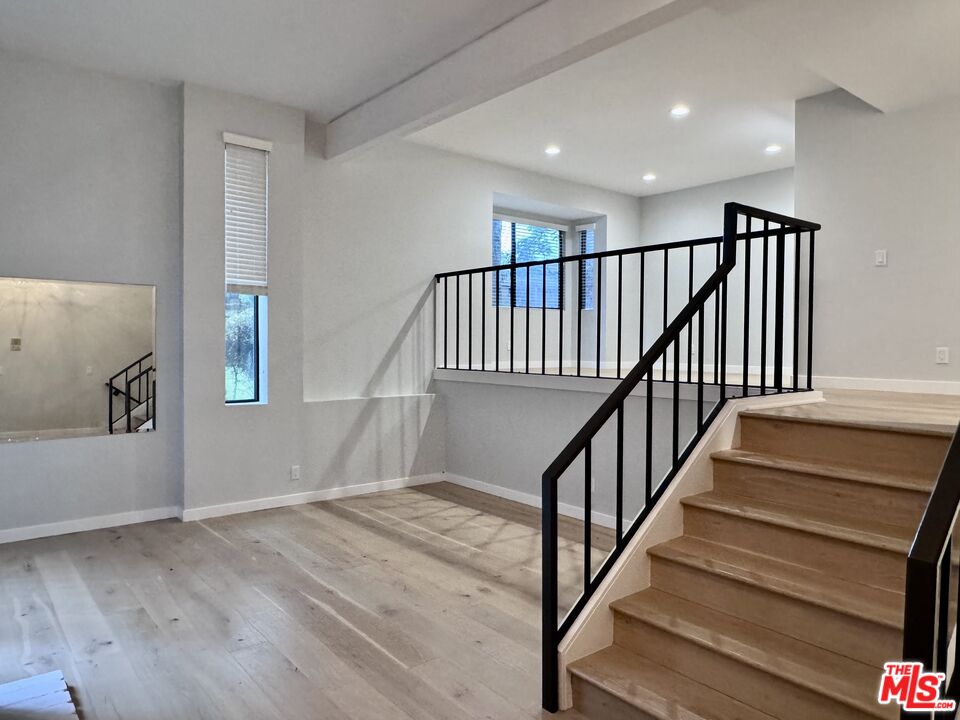4435 Alla Road, Unit 4 Marina del Rey, CA 90292 - Photo 4 of 23 a view of staircase with wooden floor and a window