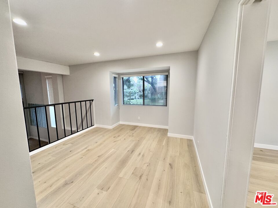 4435 Alla Road, Unit 4 Marina del Rey, CA 90292 - Photo 5 of 23 a view of empty room with wooden floor and fan