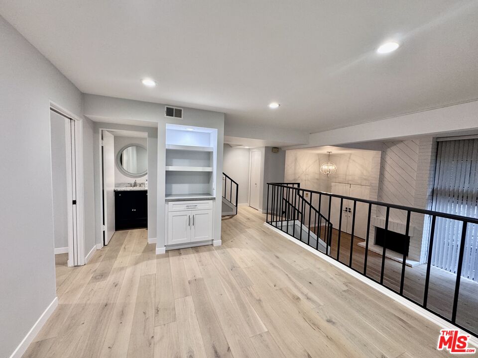 4435 Alla Road, Unit 4 Marina del Rey, CA 90292 - Photo 6 of 23 a view of a hallway with wooden floor closet and windows