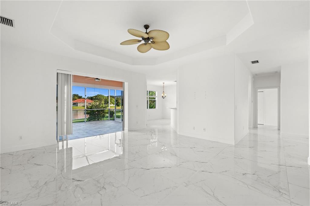 3972 Ruxton Road Naples, FL 34116 - Photo 2 of 41 a view of a livingroom with a ceiling fan and window