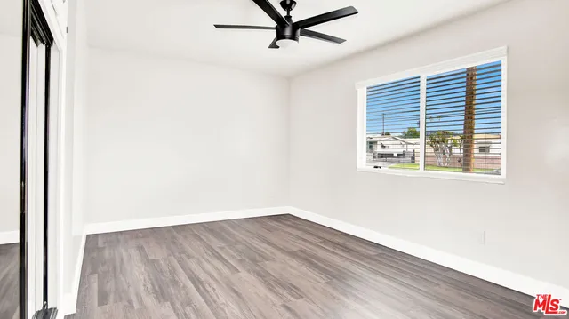 a bathroom with a granite countertop sink a toilet and bathtub