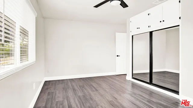 a view of a swimming pool with a yard