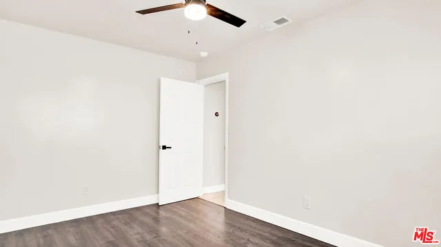 a view of a house with a backyard and a patio