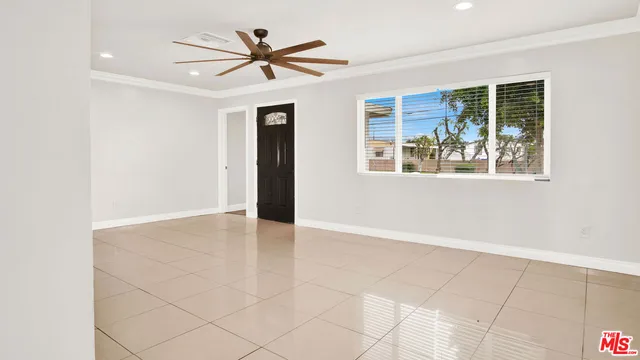 a kitchen with stainless steel appliances granite countertop a sink and a window