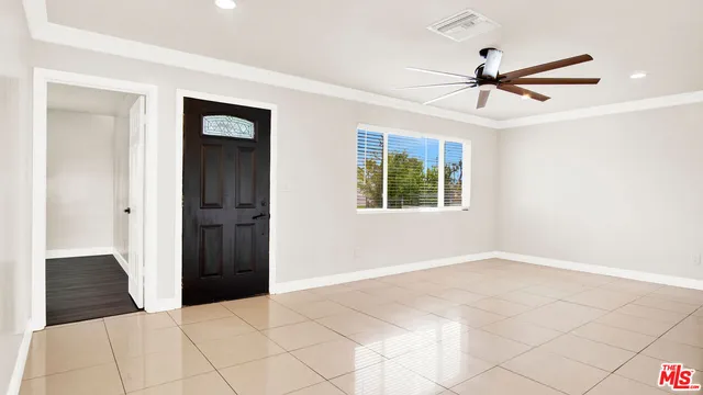 a kitchen with granite countertop a sink a stove and cabinets