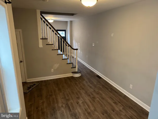 a view of entryway with wooden floor