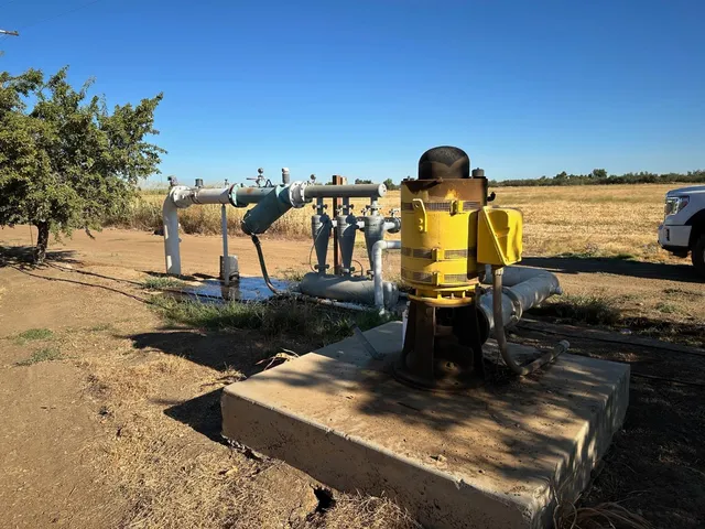 a view of a street with trees on both side of it