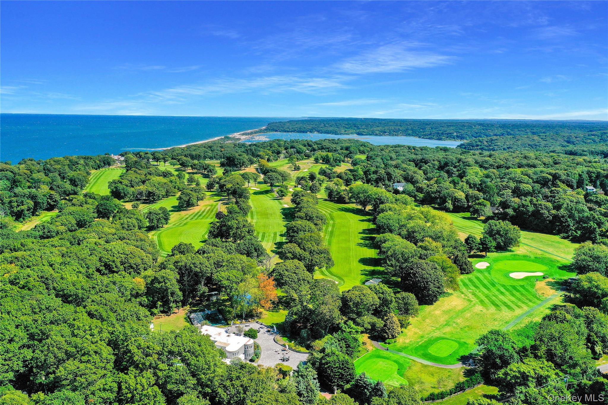 Bird's eye view of a large body of water and a golf course
