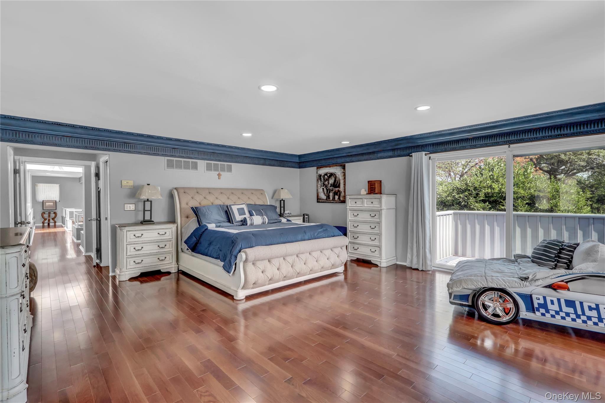 83 Cliff Road Port Jefferson, NY 11777 - Photo 28 of 50 Bedroom featuring dark wood-type flooring and recessed lighting