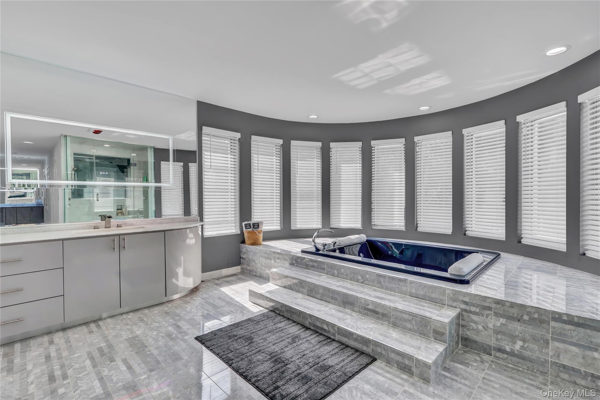 83 Cliff Road Port Jefferson, NY 11777 - Photo 29 of 50 Full bath with vanity, a shower stall, light tile patterned flooring, a garden tub, and recessed lighting