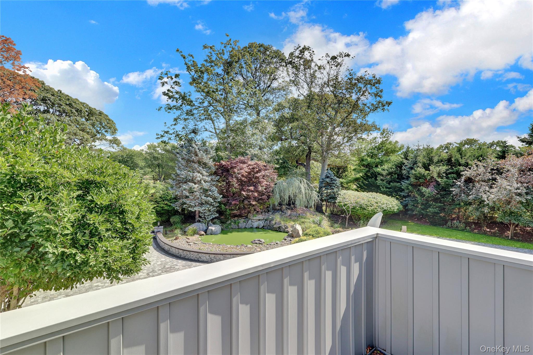 83 Cliff Road Port Jefferson, NY 11777 - Photo 33 of 50 Balcony featuring view of wooded area